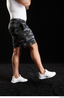 Grigory  1 camo shorts dressed flexing leg side view…